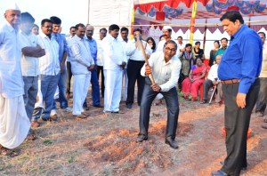 Shirish cutting the first piece of turf.